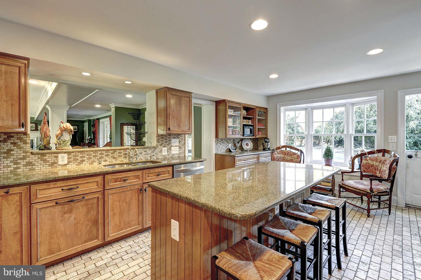 10017 Chapel Road Potomac, MD 20854 - Photo 7 of 26 a dining hall with stainless steel appliances granite countertop a table and chairs