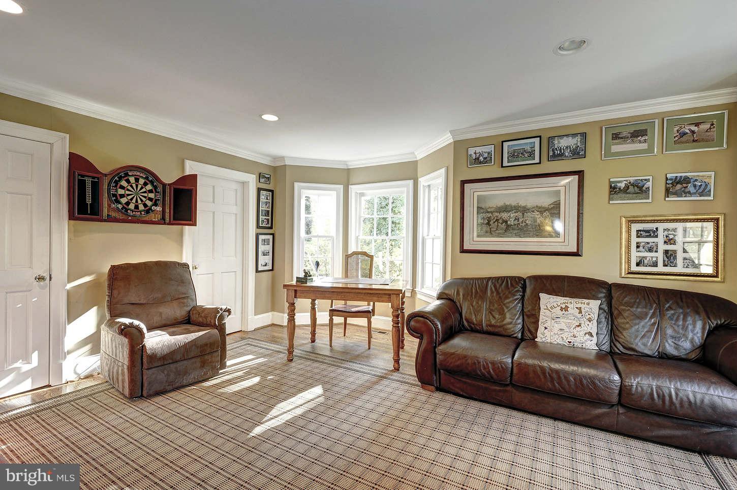 10017 Chapel Road Potomac, MD 20854 - Photo 10 of 26 a living room with furniture and a flat screen tv