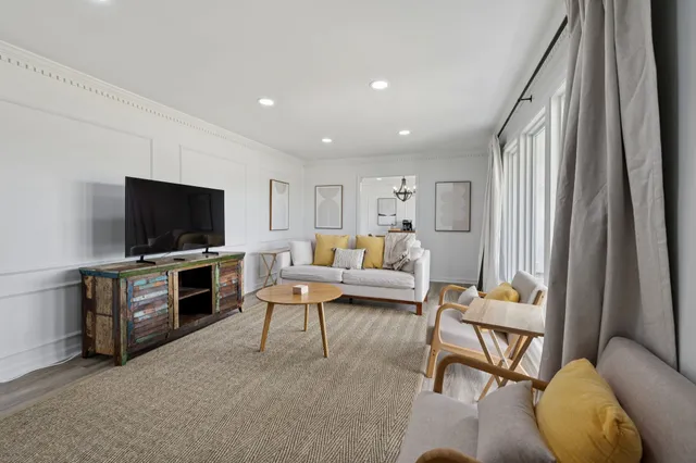 an aerial view of a house with a garden and swimming pool