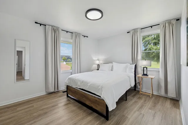 a view of a swimming pool with a yard