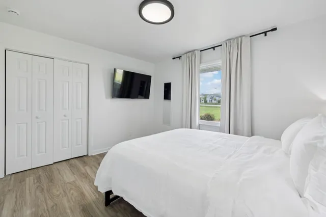 a front view of a house with a garden and porch