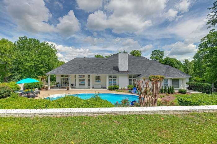 4675 Everal Lane Franklin, TN 37064 - Photo 8 of 15 a front view of a house with a garden and trees