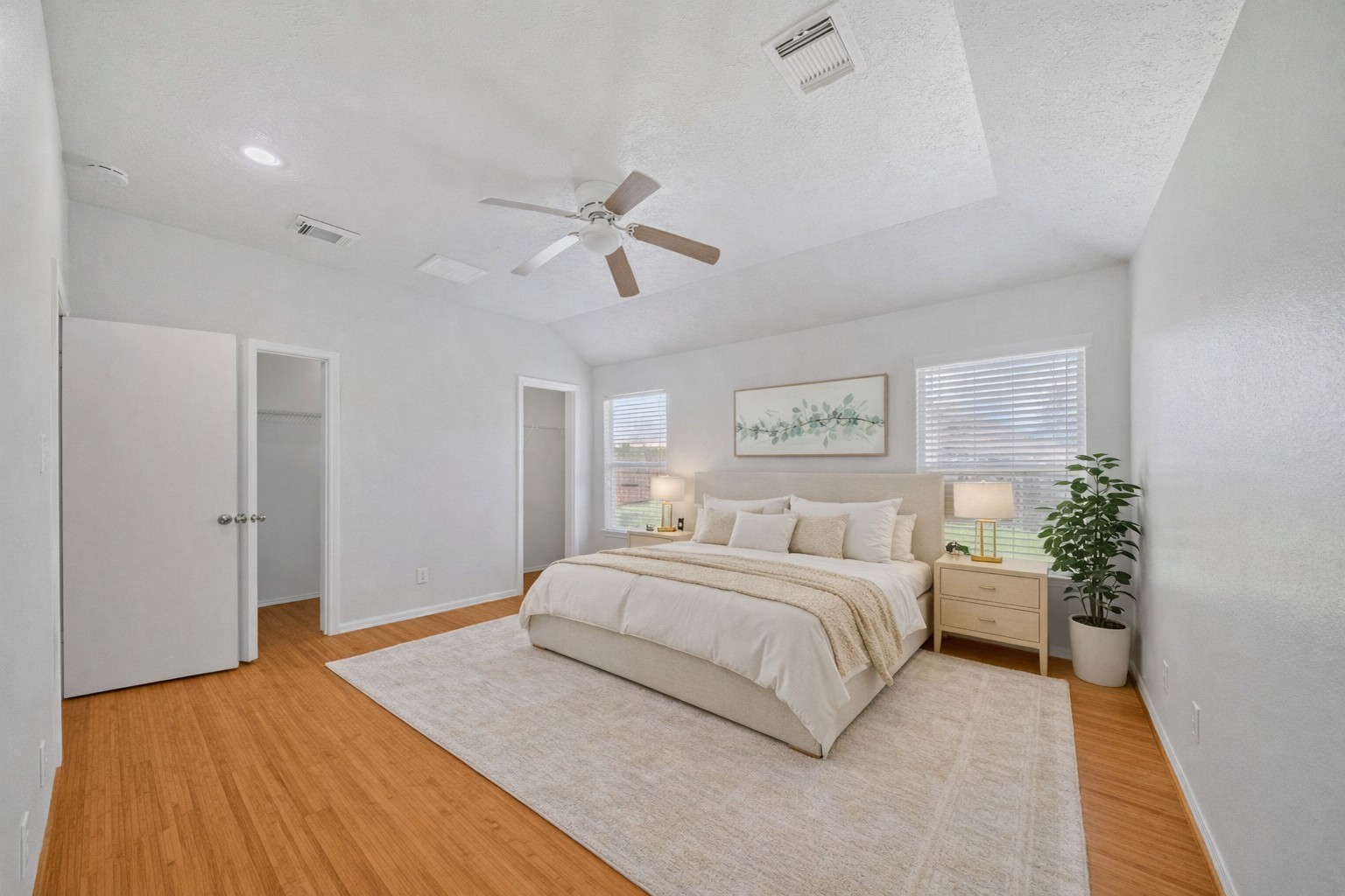 14323 Brunswick Point Lane Houston, TX 77047 - Photo 14 of 33 a spacious bedroom with a bed and a chandelier