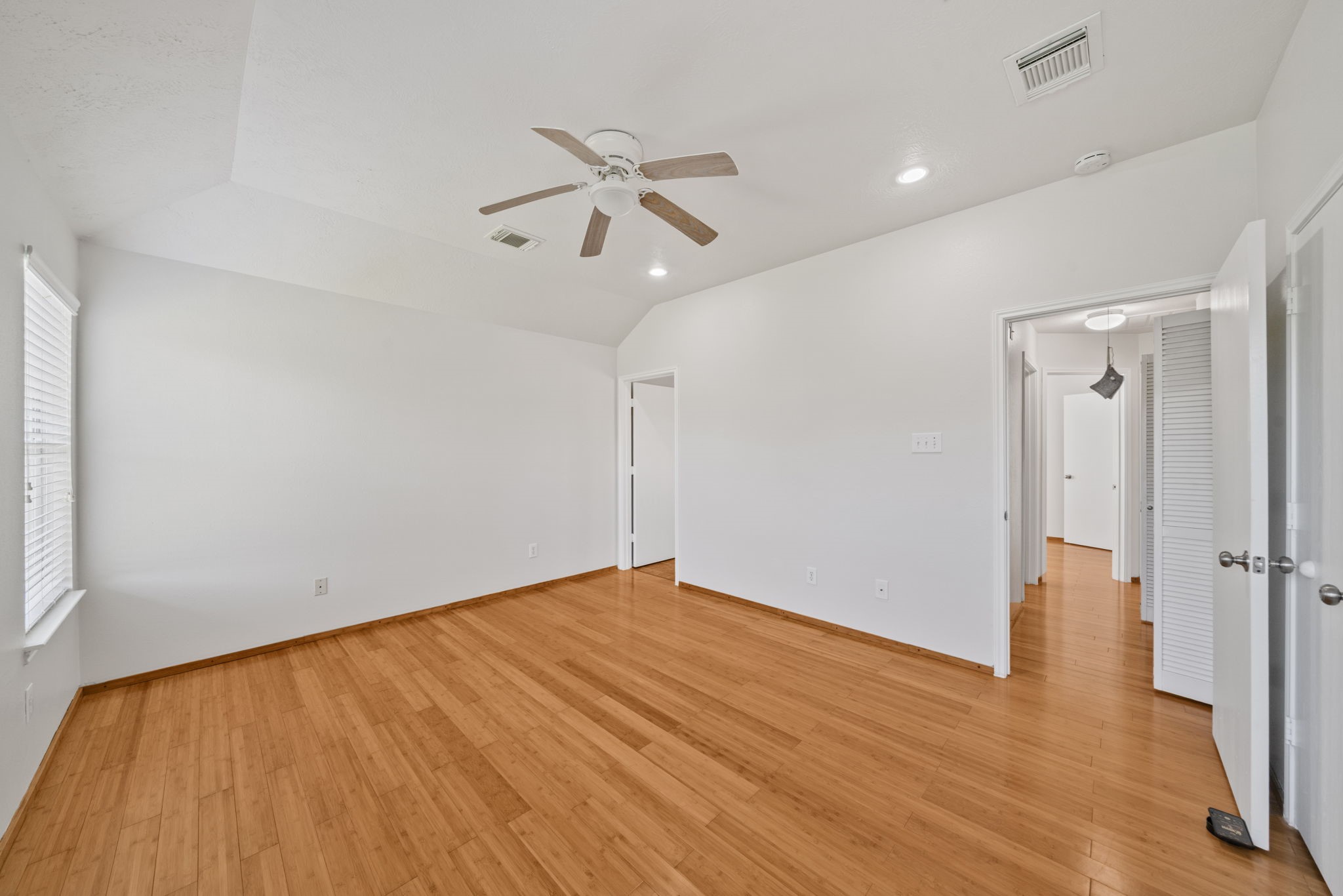 14323 Brunswick Point Lane Houston, TX 77047 - Photo 17 of 33 wooden floor in an empty room with a window