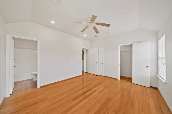 a view of hallway with wooden floor