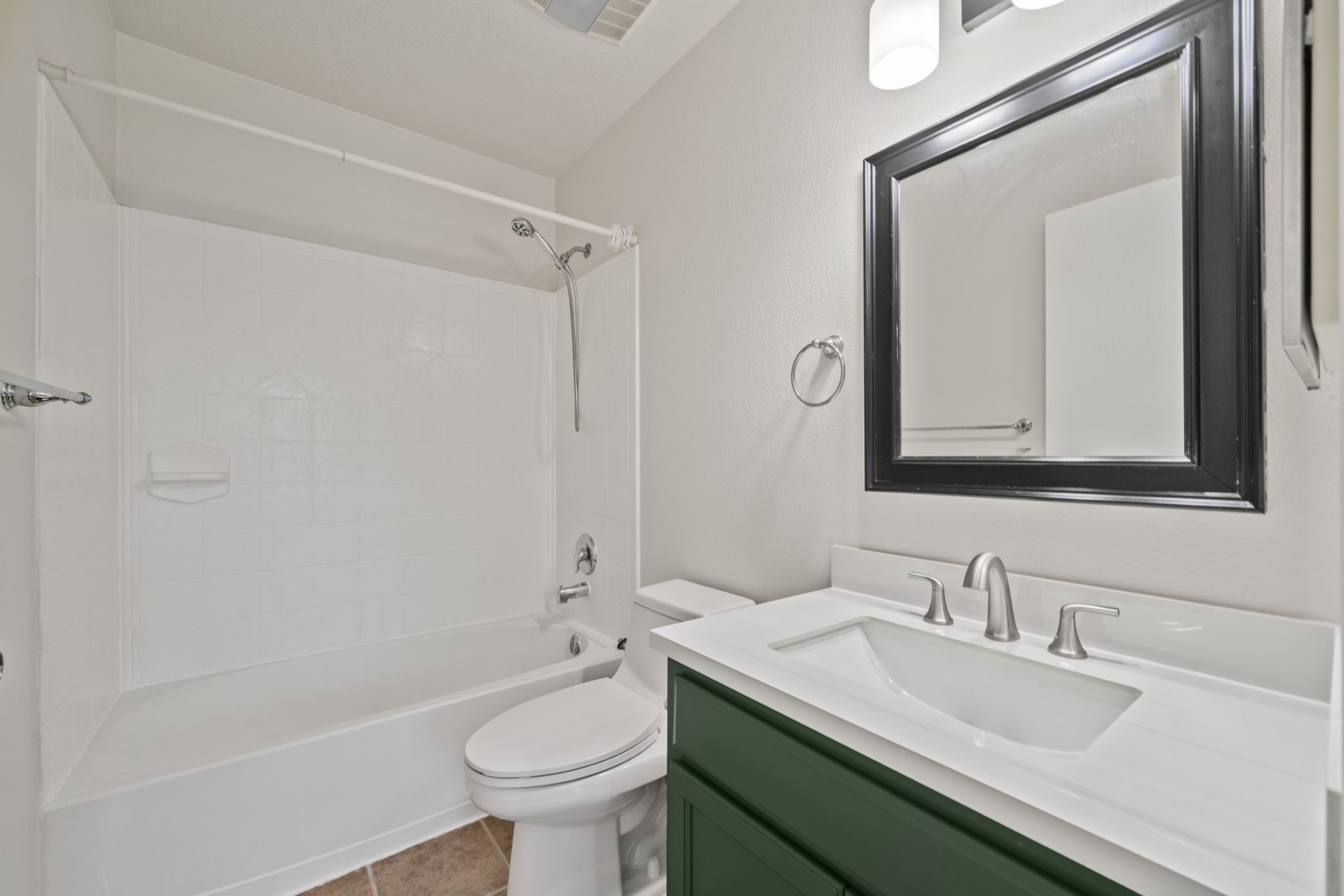 14323 Brunswick Point Lane Houston, TX 77047 - Photo 20 of 33 a bathroom with a granite countertop sink a toilet and a mirror