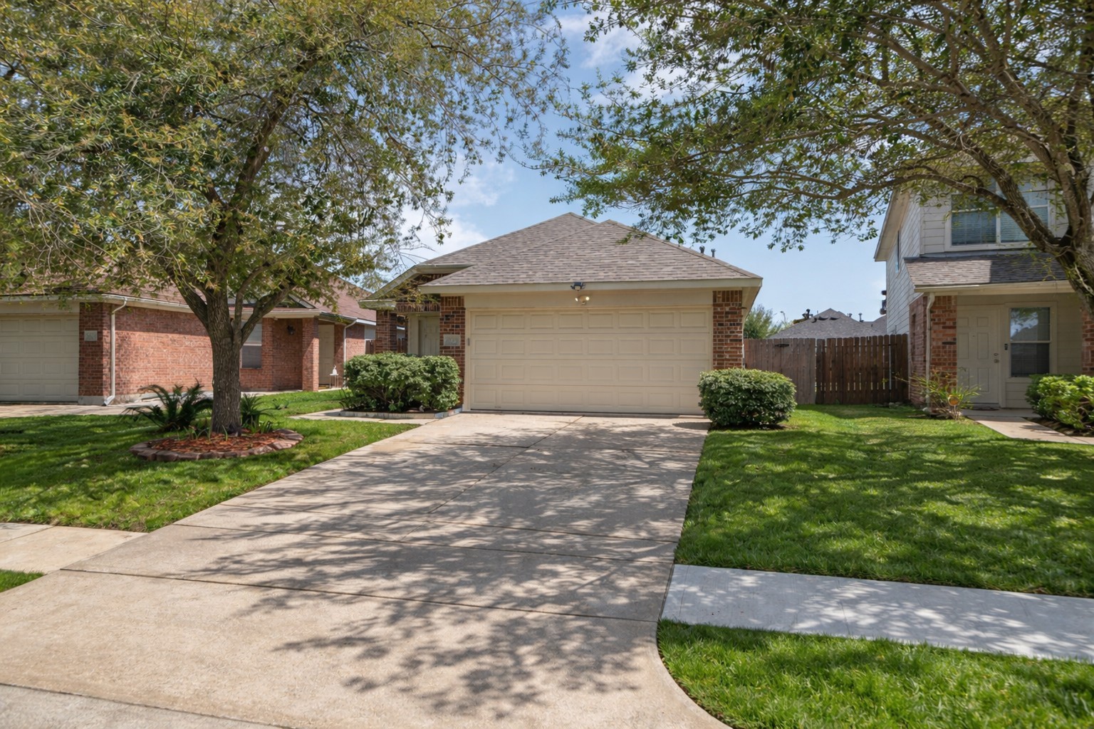 14323 Brunswick Point Lane Houston, TX 77047 - Photo 2 of 33 a front view of a house with a garden