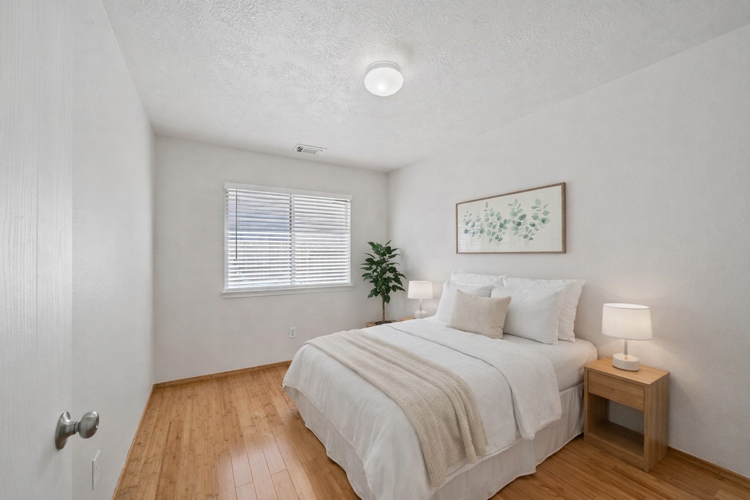 14323 Brunswick Point Lane Houston, TX 77047 - Photo 21 of 33 a bedroom with a bed and a painting on the wall