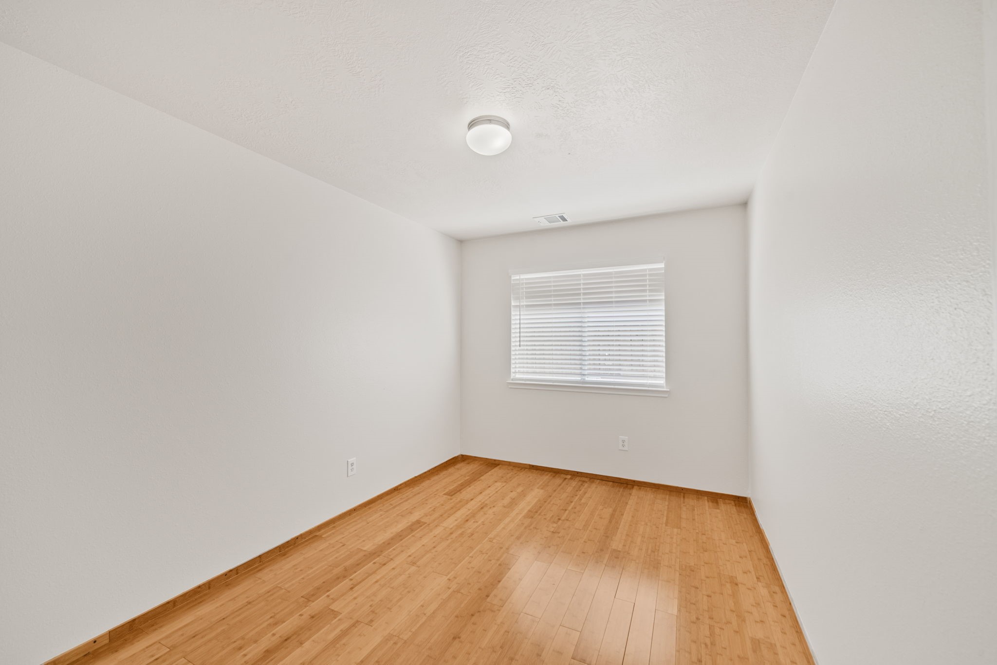 14323 Brunswick Point Lane Houston, TX 77047 - Photo 26 of 33 a view of empty room with wooden floor