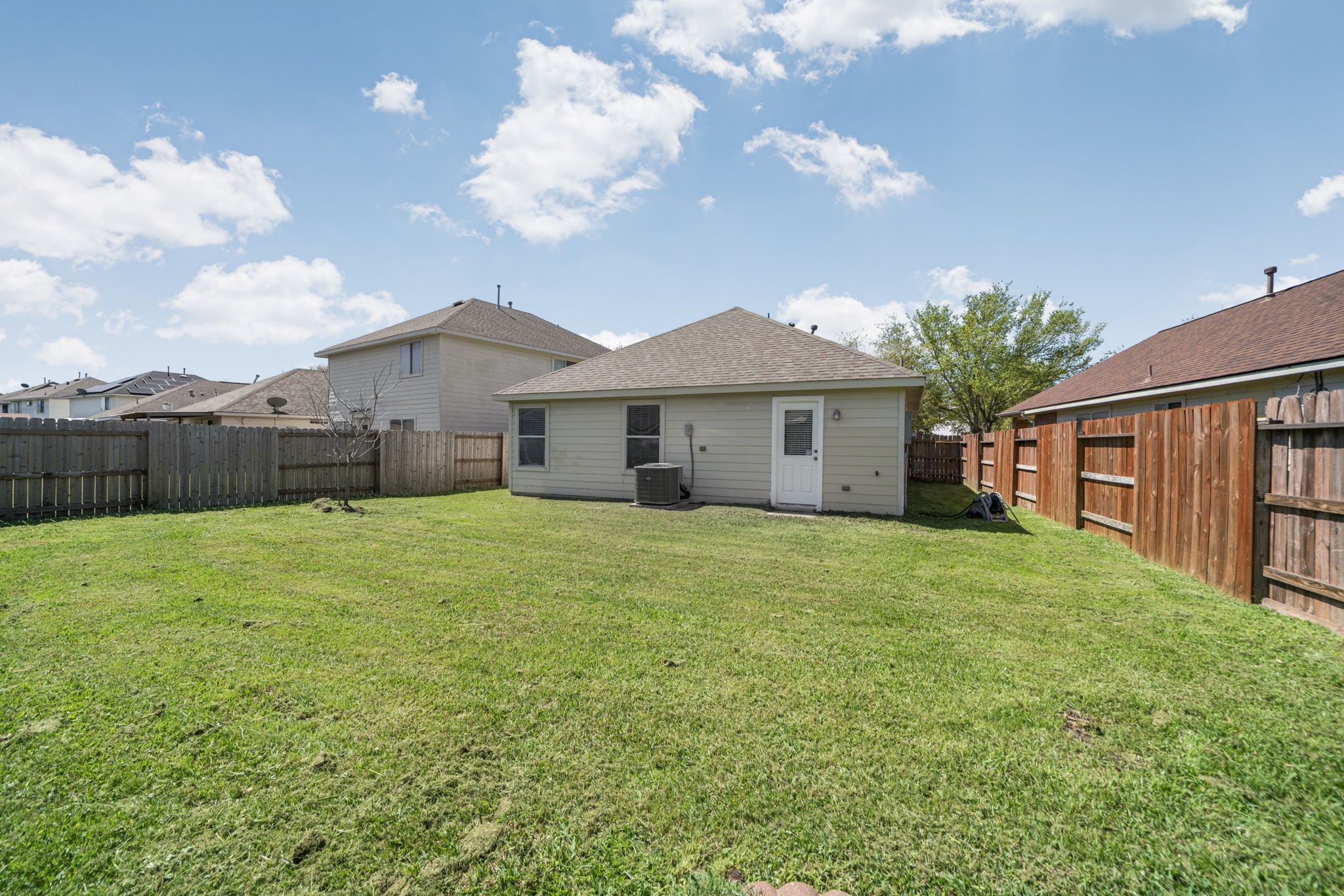 14323 Brunswick Point Lane Houston, TX 77047 - Photo 32 of 33 a view of a yard in front of a house with a large tree