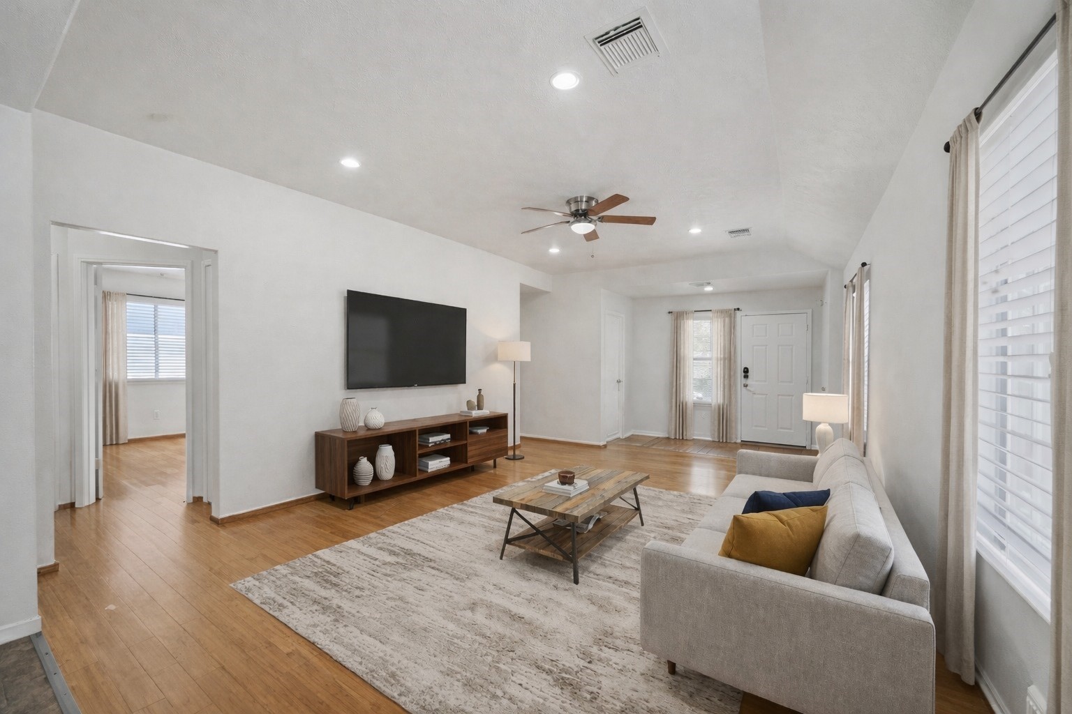 14323 Brunswick Point Lane Houston, TX 77047 - Photo 5 of 33 a living room with furniture and a flat screen tv