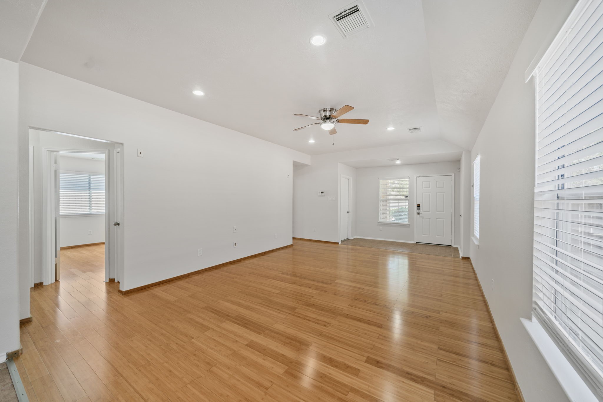 14323 Brunswick Point Lane Houston, TX 77047 - Photo 6 of 33 a view of an empty room with wooden floor