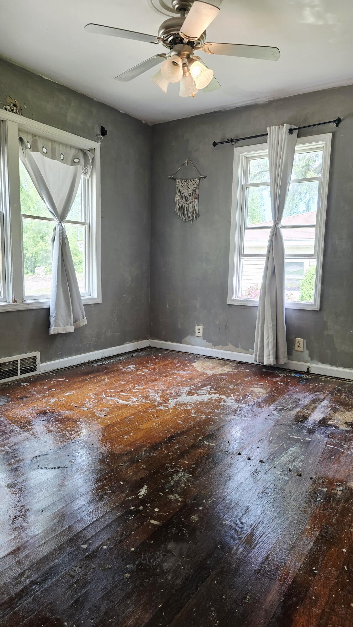 2207 North County Line Road Portage, IN 46368 - Photo 16 of 16 an empty room with wooden floor and windows