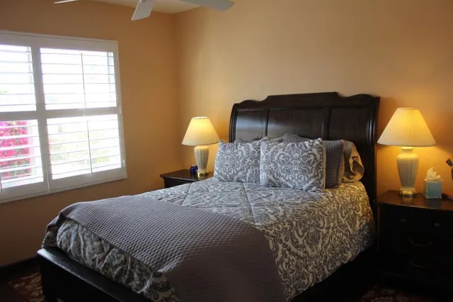 a room with a mirror and vanity