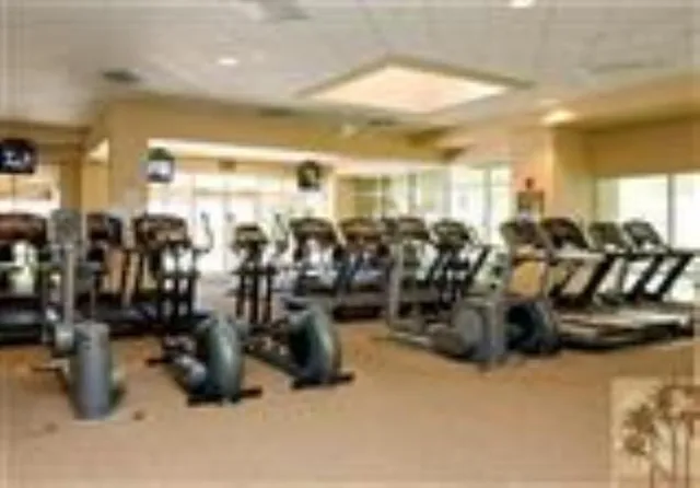 a backyard of a house with barbeque oven table and chairs