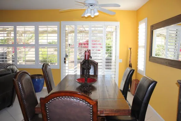a dining room with furniture and window
