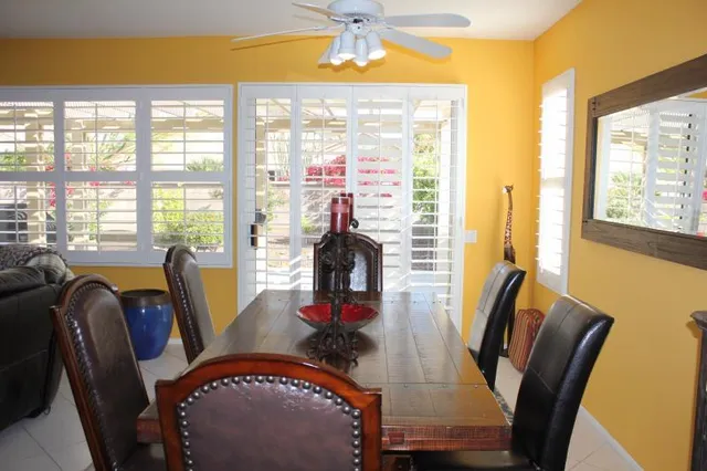 a dining room with furniture and window