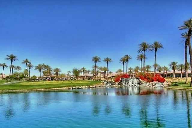a view of a lake with houses and trees