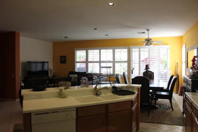 a view of a a dining room with furniture window and outside view