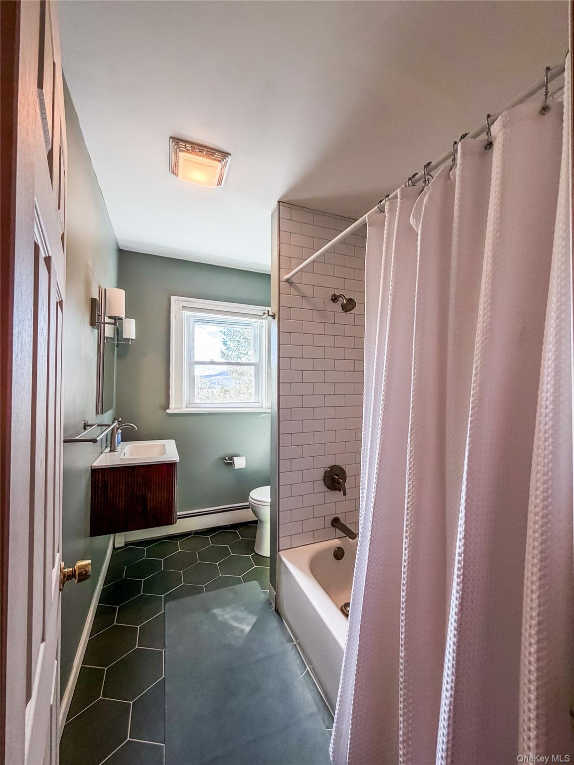 350 Smith Street Peekskill, NY 10566 - Photo 26 of 32 a bathroom with a tub and shower