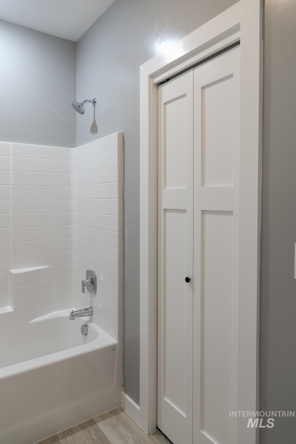 287 Southwest 6th Street, Unit 2 Ontario, OR 97914 - Photo 14 of 37 Bathroom featuring shower / bathtub combination and light wood-type flooring