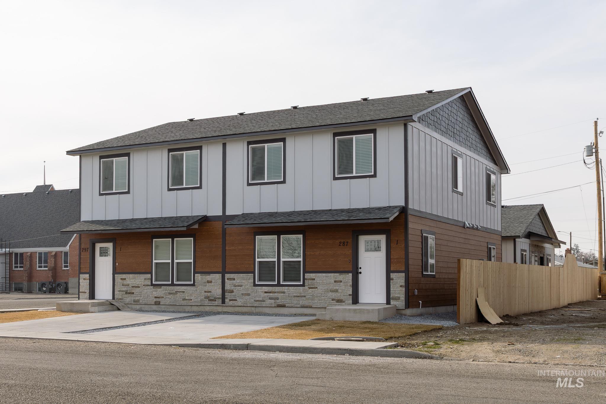 287 Southwest 6th Street, Unit 2 Ontario, OR 97914 - Photo 33 of 37 View of front of house with a shingled roof, stone siding, and board and batten siding