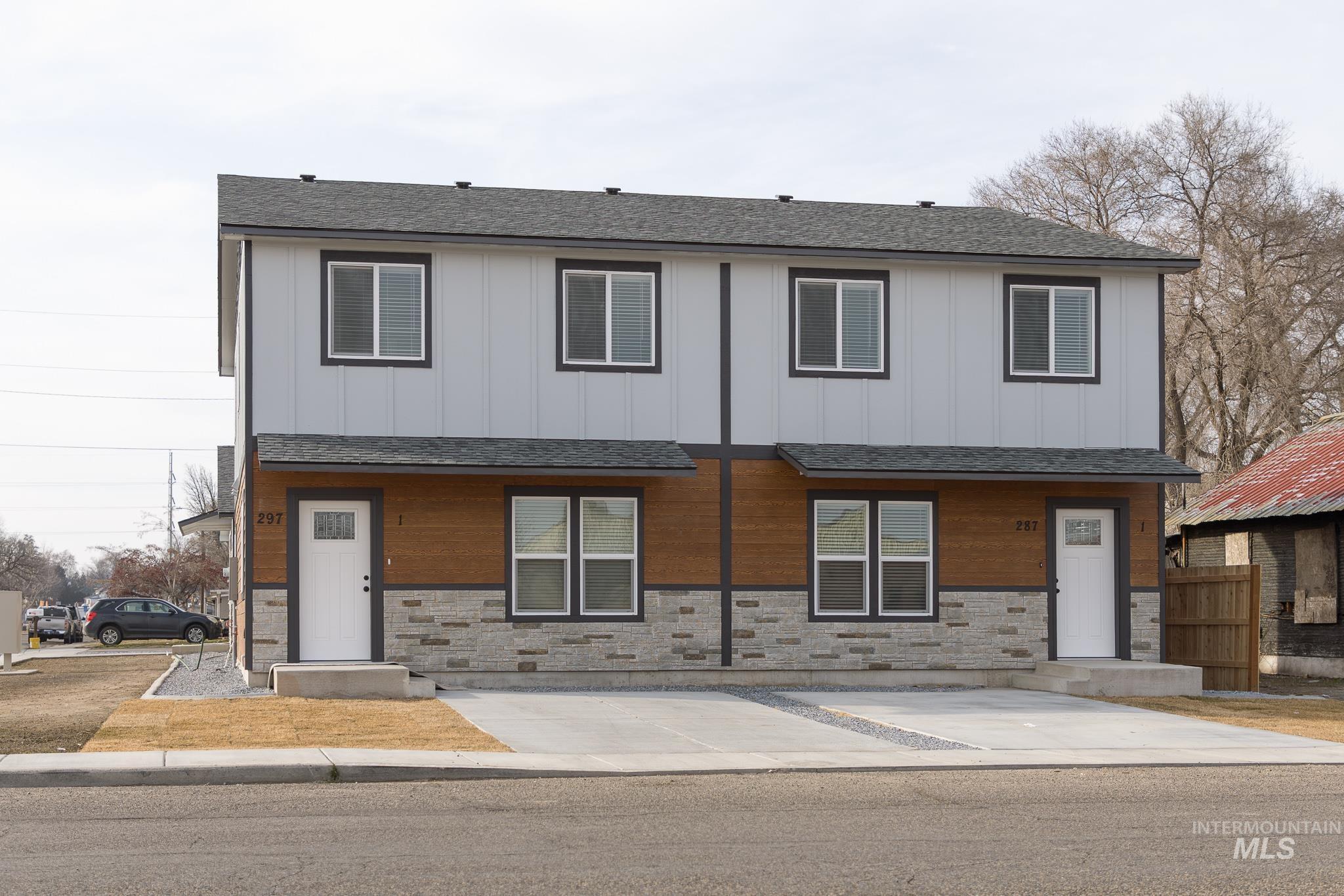 287 Southwest 6th Street, Unit 2 Ontario, OR 97914 - Photo 35 of 37 View of front facade featuring stone siding, a shingled roof, and board and batten siding