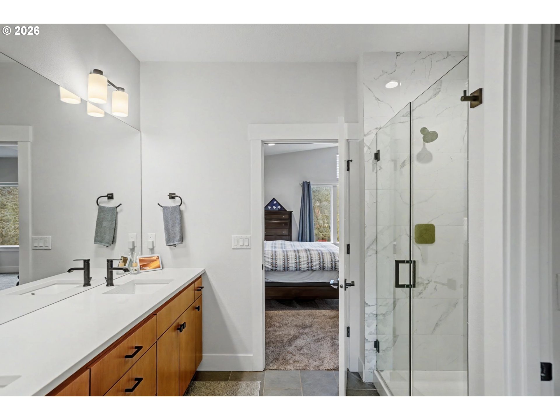 5520 Crossler Meadow Loop South Salem, OR 97306 - Photo 23 of 40 a en suite bathroom with a double vanity sink a mirror and shower