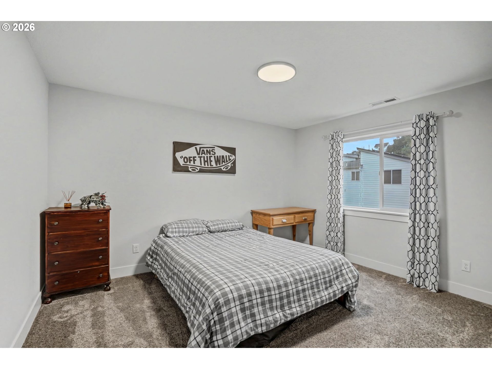 5520 Crossler Meadow Loop South Salem, OR 97306 - Photo 29 of 40 a bedroom with a bed and a dresser