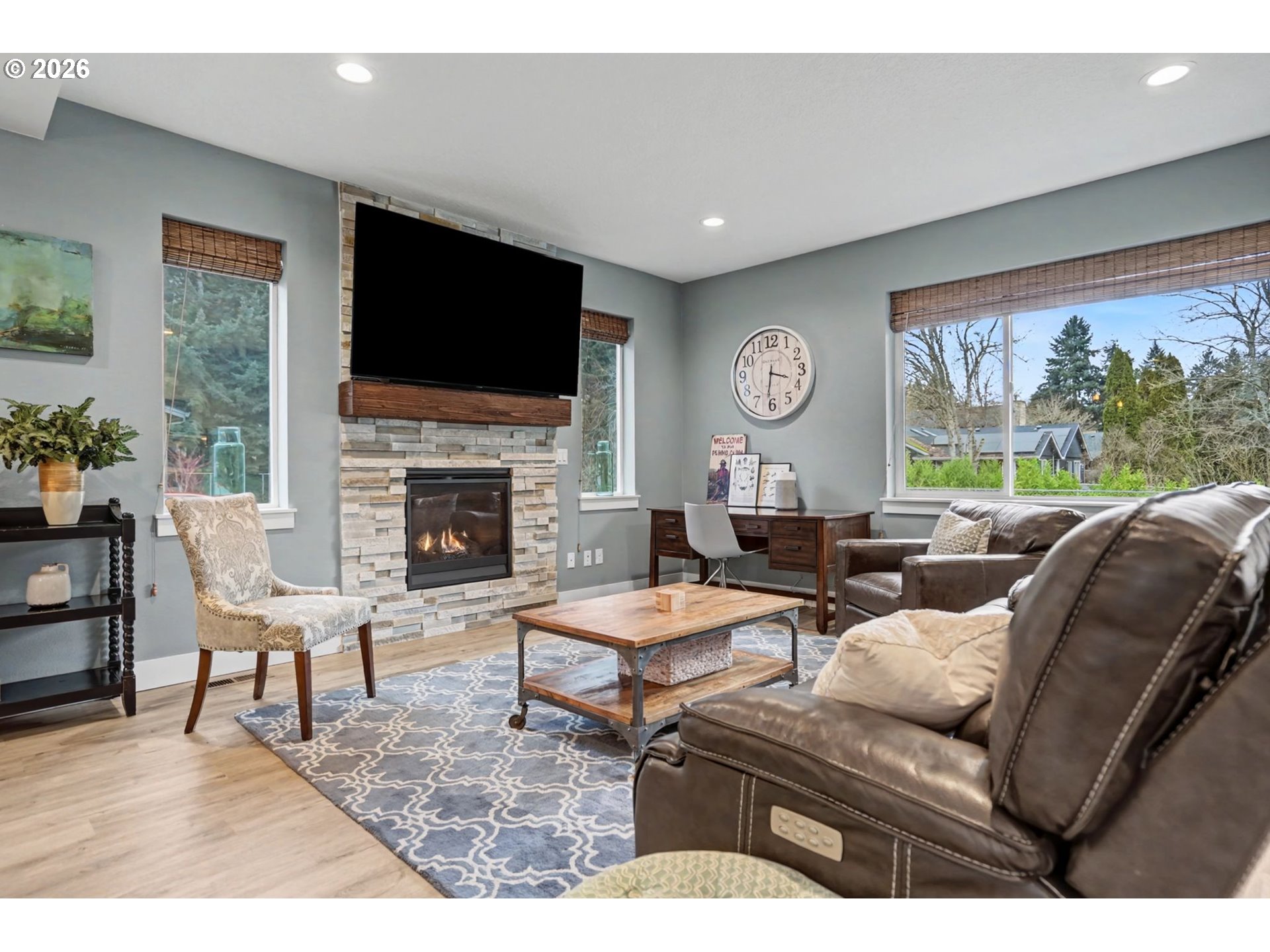 5520 Crossler Meadow Loop South Salem, OR 97306 - Photo 36 of 40 a living room with furniture a flat screen tv and a fireplace