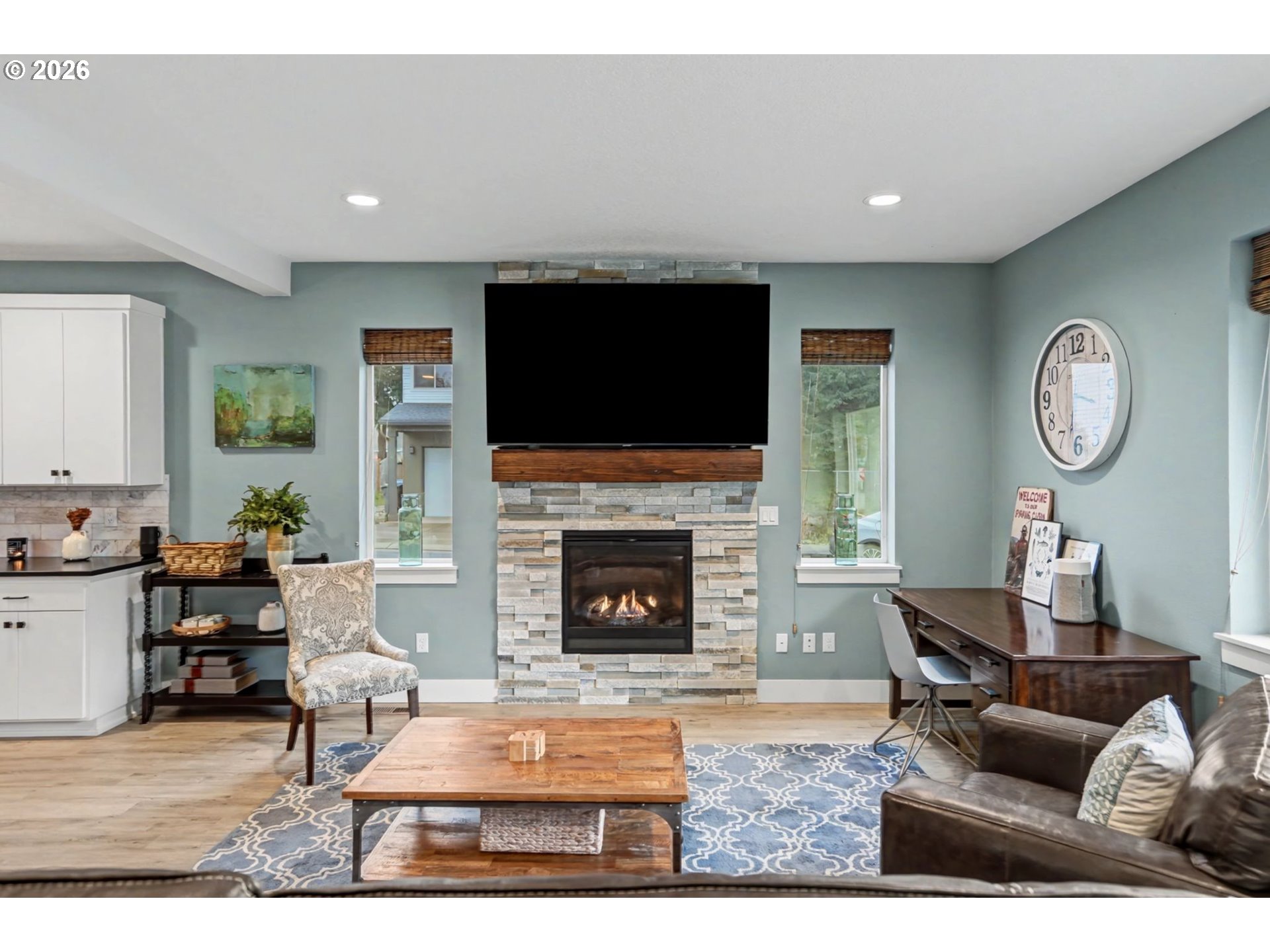 5520 Crossler Meadow Loop South Salem, OR 97306 - Photo 38 of 40 a living room with furniture a flat screen tv and a fireplace