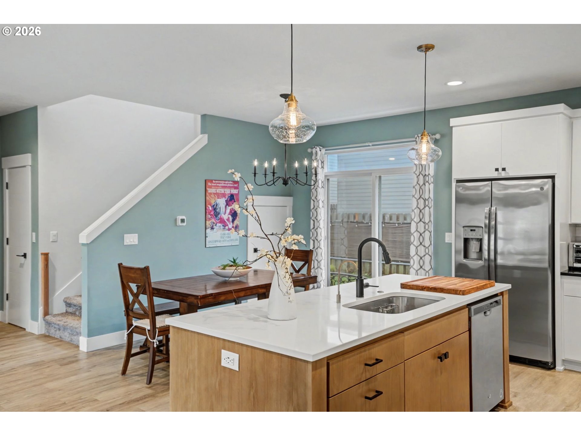 5520 Crossler Meadow Loop South Salem, OR 97306 - Photo 10 of 40 a kitchen with a table chairs sink and refrigerator