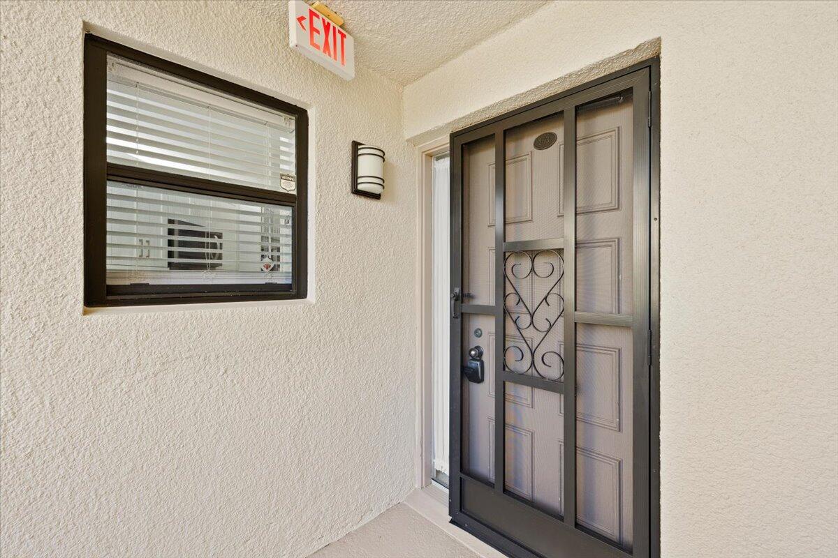5851 Camino Del Sol, Unit 203 Boca Raton, FL 33433 - Photo 23 of 33 FRONT DOOR