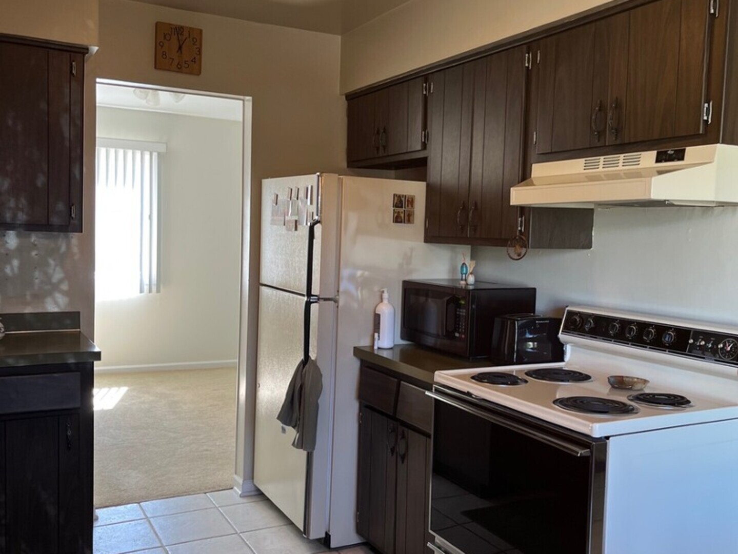 1690 Darwin Court Wheaton, IL 60189 - Photo 2 of 17 a kitchen with a stove top oven and refrigerator