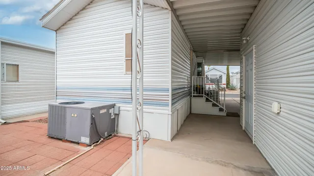 a view of a patio with table and chairs and potted plants