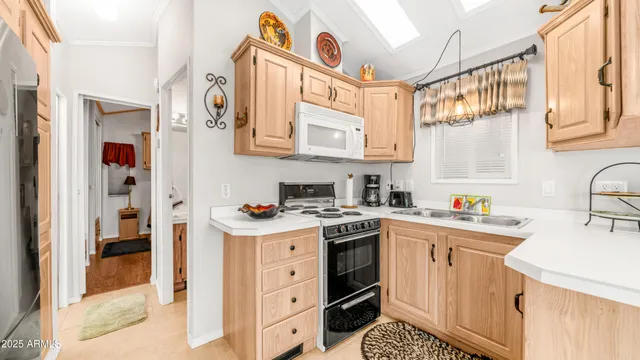 a kitchen with stainless steel appliances granite countertop a sink and cabinets