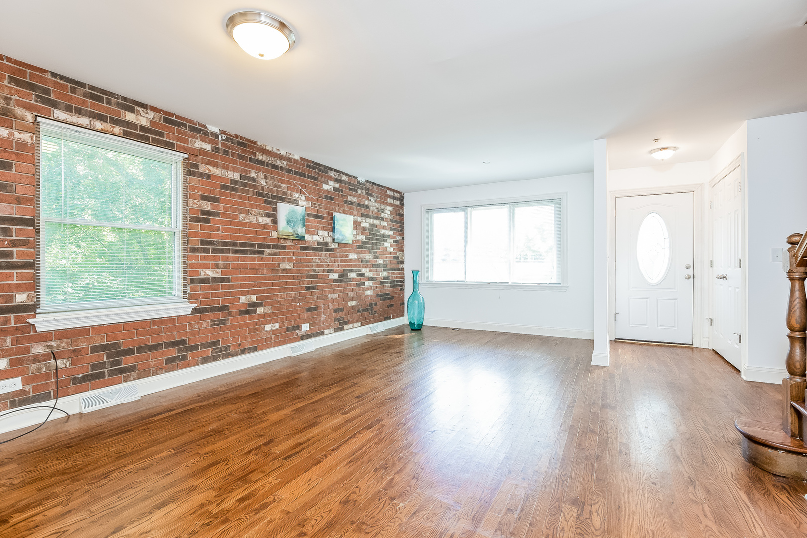 820 Green Bay Road Highwood, IL 60040 - Photo 2 of 16 an empty room with wooden floor and windows