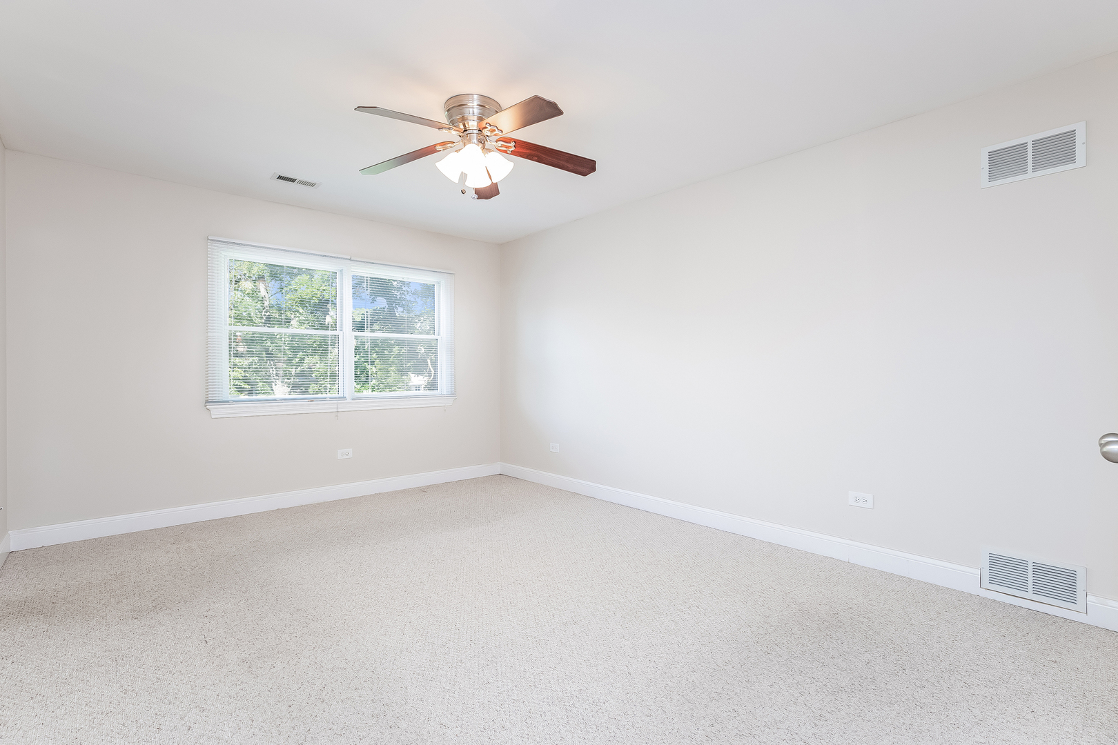 820 Green Bay Road Highwood, IL 60040 - Photo 12 of 16 an empty room with windows and fan