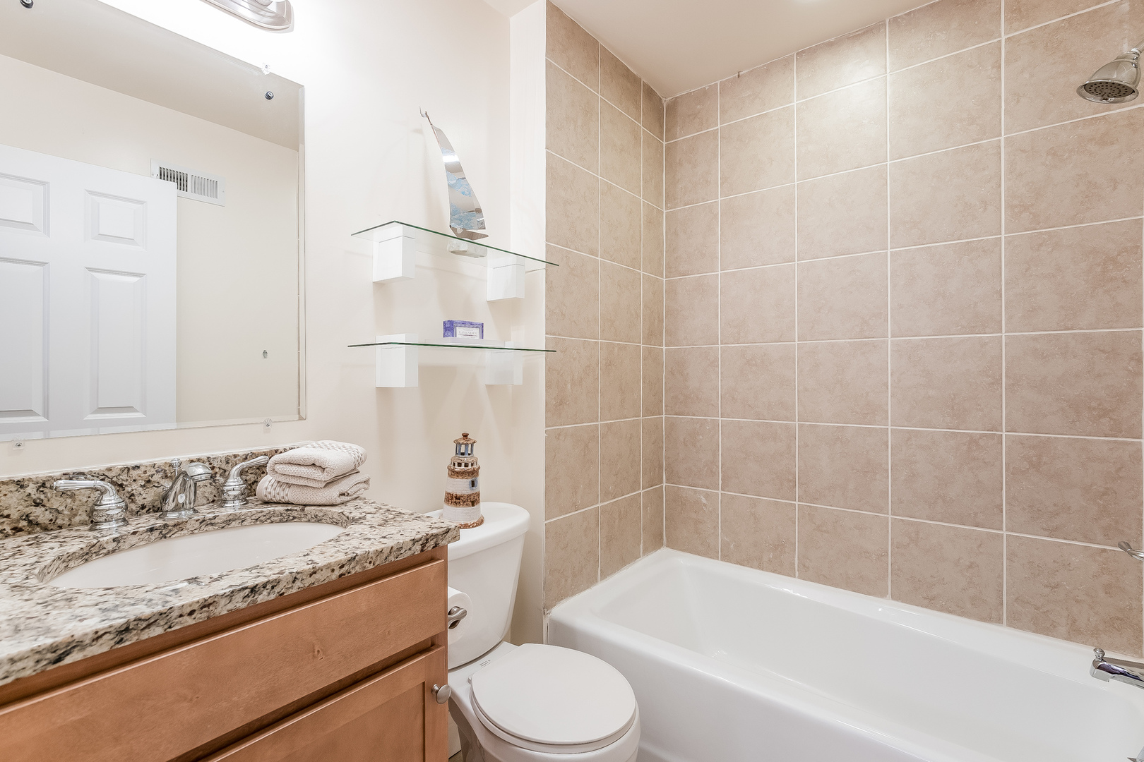 820 Green Bay Road Highwood, IL 60040 - Photo 13 of 16 a bathroom with a granite countertop bathtub shower sink vanity and toilet