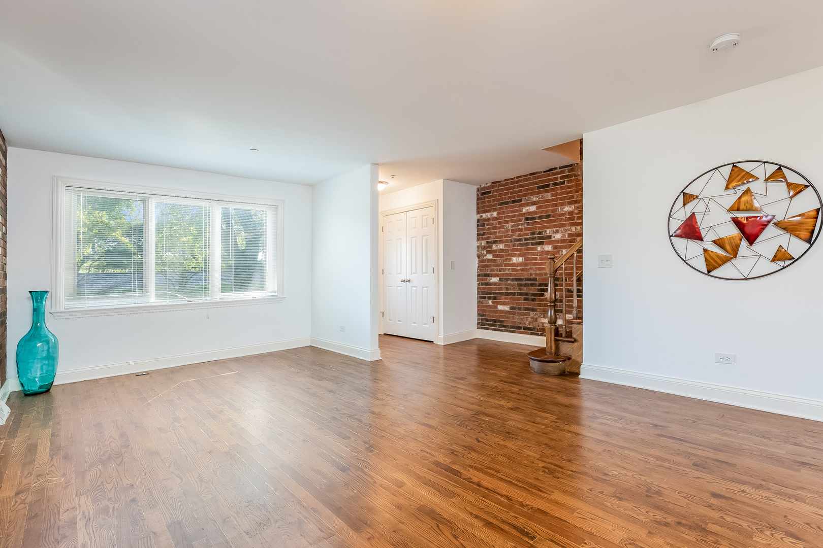 820 Green Bay Road Highwood, IL 60040 - Photo 4 of 16 wooden floor in an empty room with a window