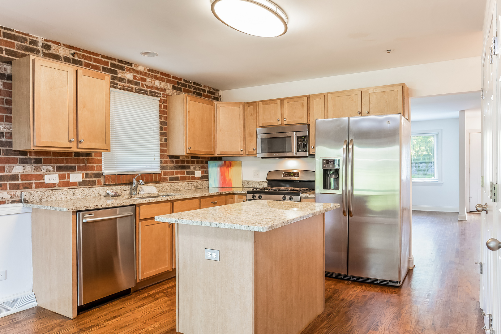 820 Green Bay Road Highwood, IL 60040 - Photo 5 of 16 a kitchen with a refrigerator a stove cabinets and wooden floor