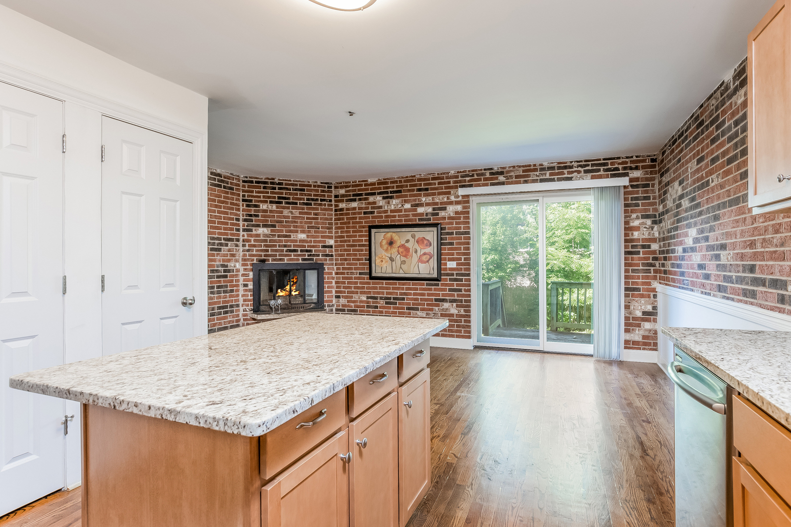 820 Green Bay Road Highwood, IL 60040 - Photo 6 of 16 a kitchen with granite countertop a stove and a wooden floors