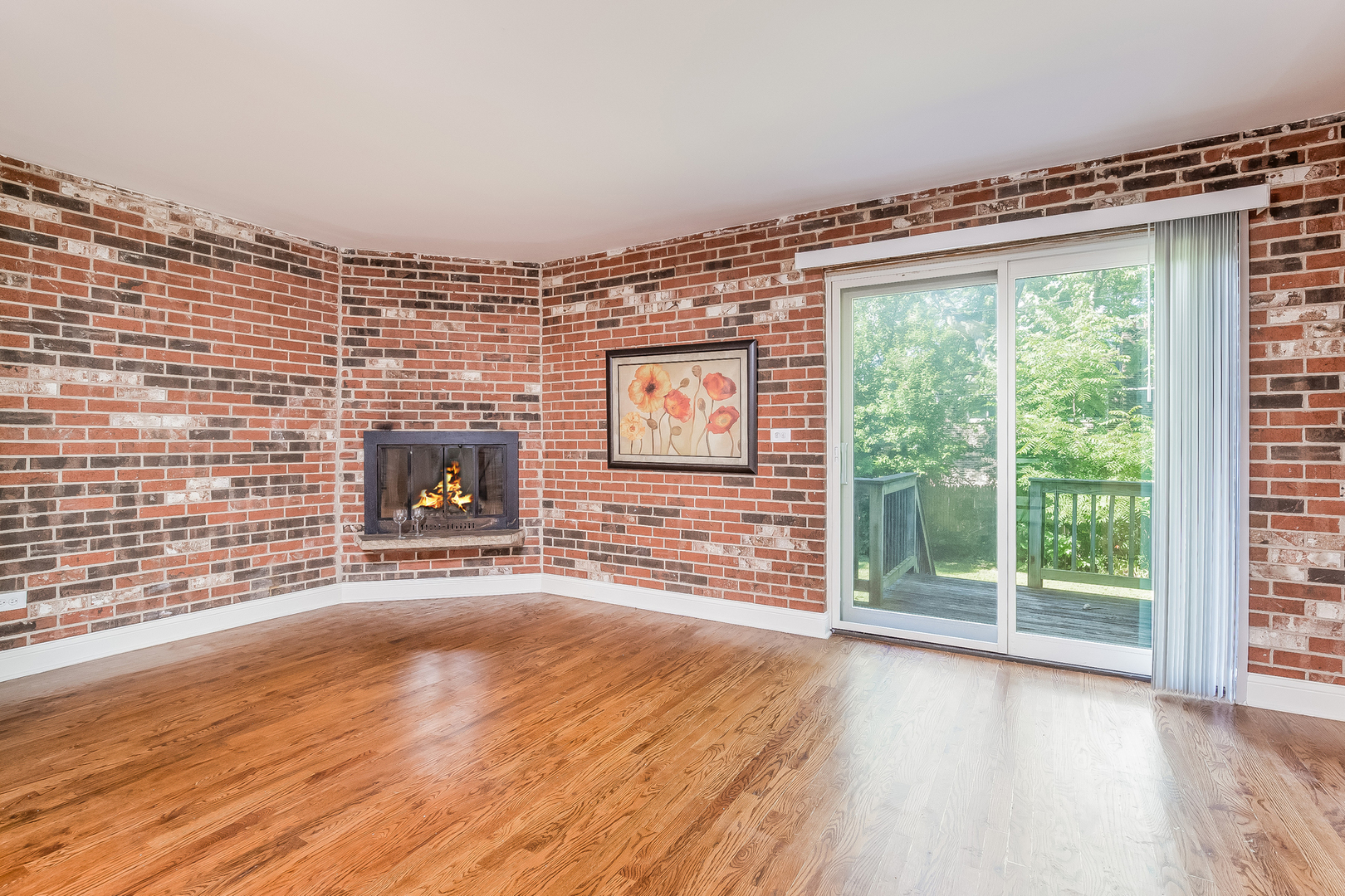 820 Green Bay Road Highwood, IL 60040 - Photo 8 of 16 an empty room with wooden floor and fireplace