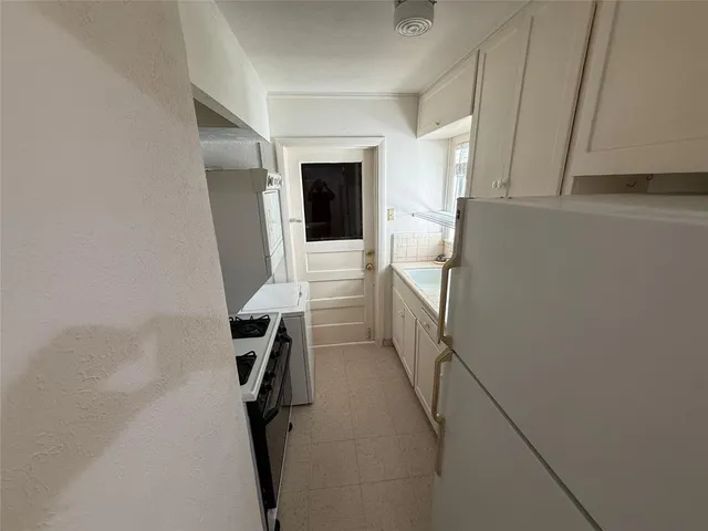 a bathroom with a sink a toilet and dryer