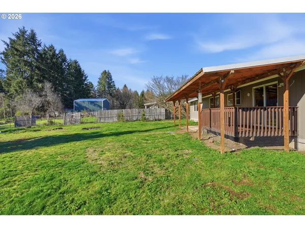 a view of a house with a big yard
