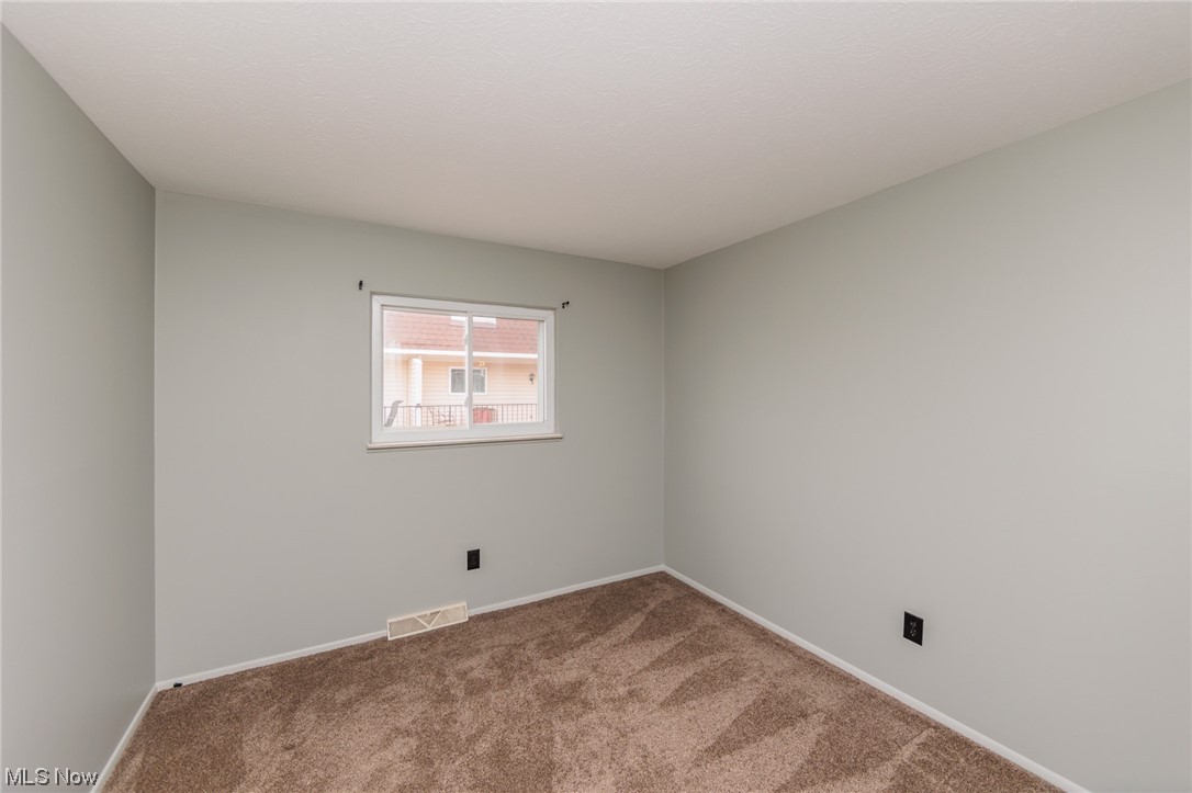 6472 State Road, Unit J19 Parma, OH 44134 - Photo 27 of 33 View of carpeted spare room