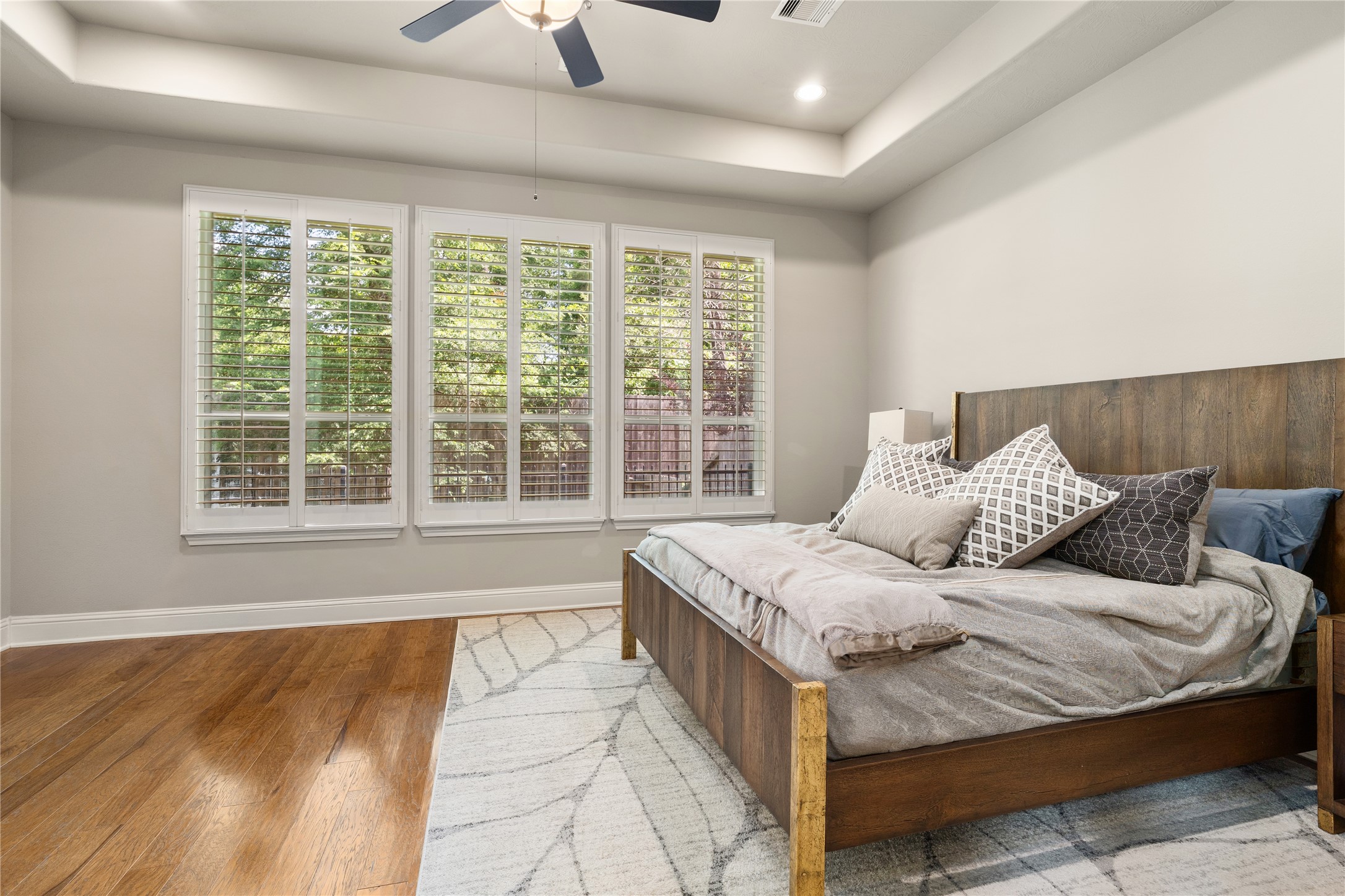 19813 Cullen Ridge Drive Porter, TX 77365 - Photo 21 of 44 This inviting bedroom feels expansive thanks to the large windows that flood the space with natural light.