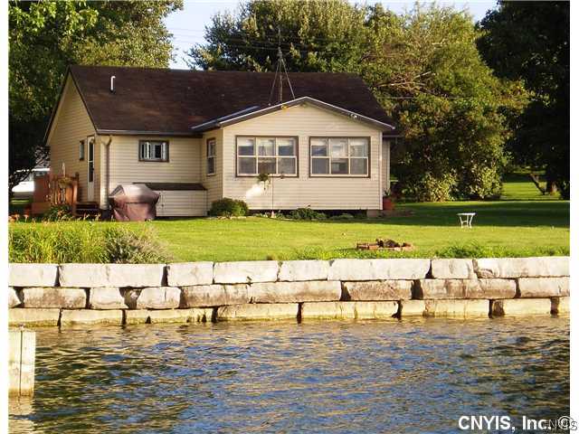 2123 Kelly Road Cape Vincent, NY 13618 - Photo 1 of 1 Exterior Front. Look at the great shore wall. Plen