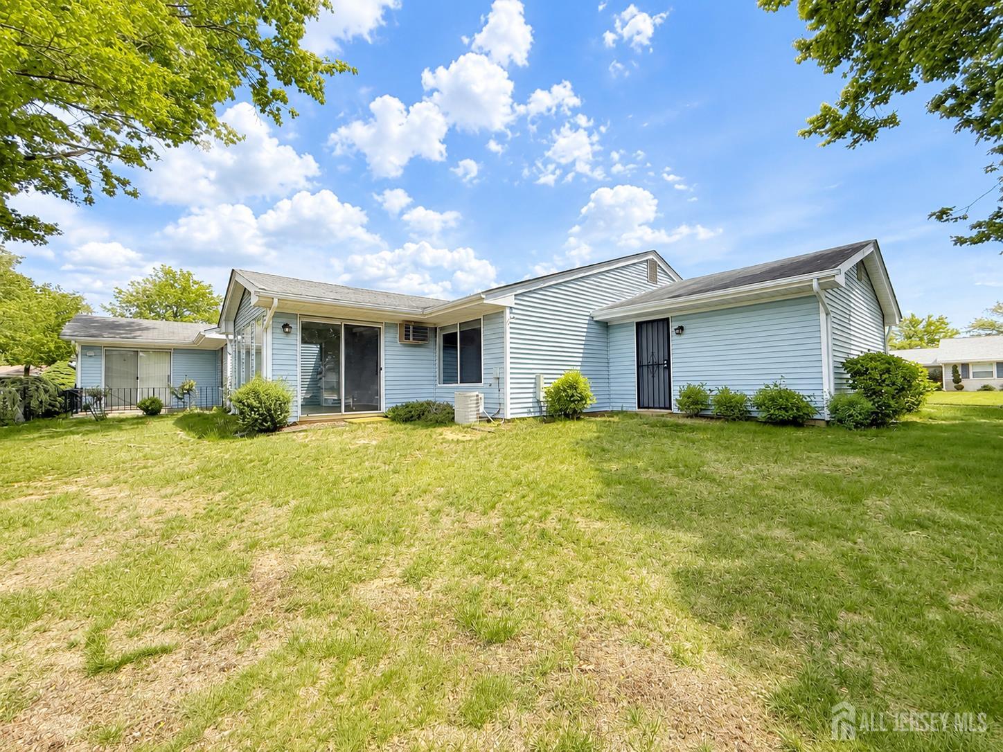 621 A Deal Road Monroe Township, NJ 08831 - Photo 25 of 27 a view of a house with a yard and potted plants