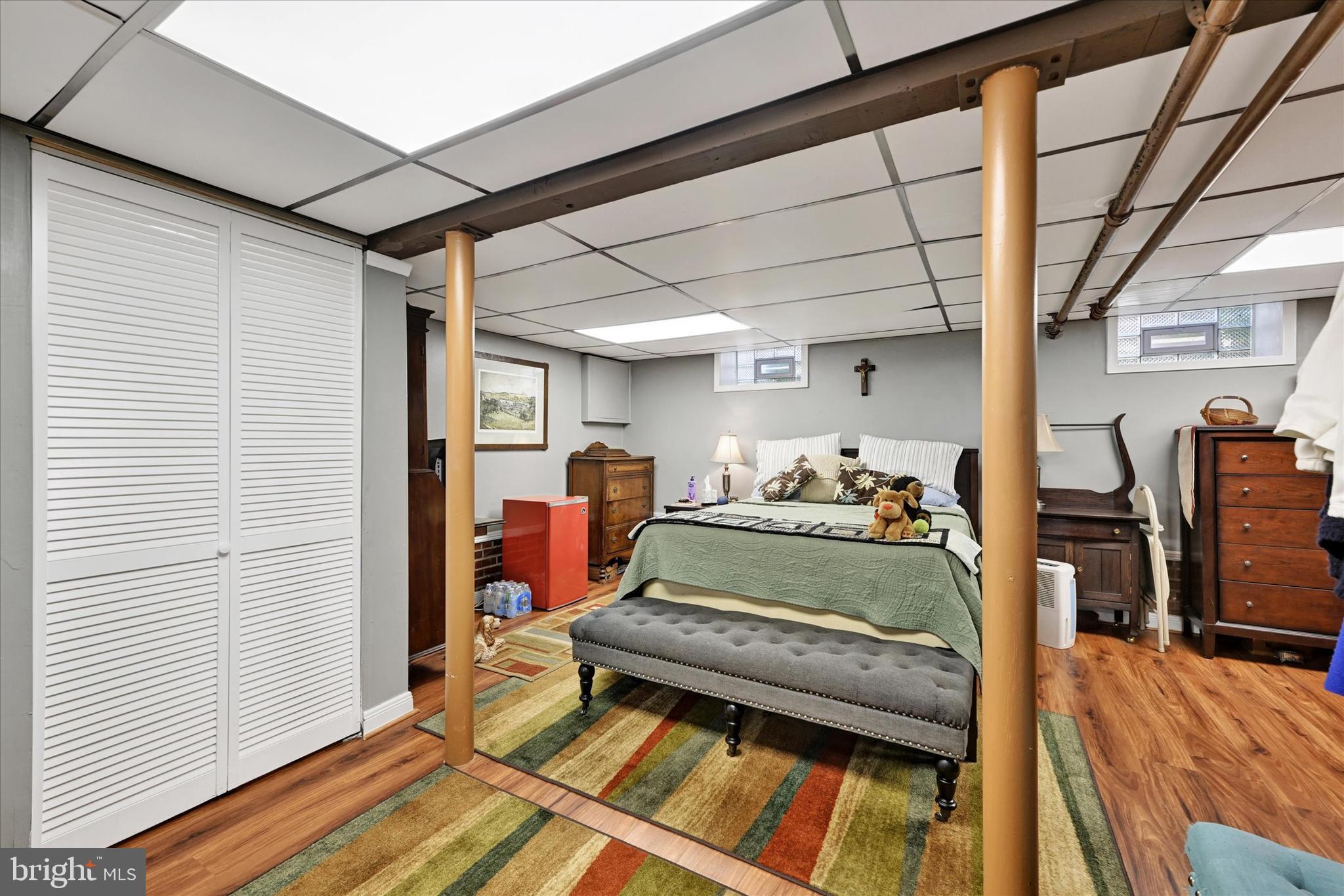 619 Warwick Road Baltimore, MD 21229 - Photo 25 of 41 a bedroom with furniture and a wooden floor